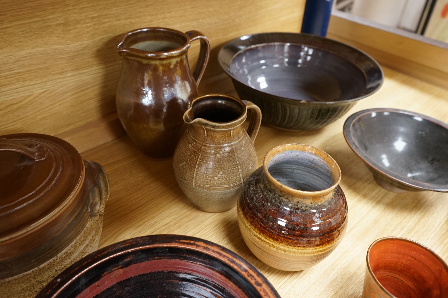 A Poole pottery Aegean dish, together with a selection of Studio pottery bowls, dishes, jugs etc and a Donoghue / Rye cottage model, Poole dish 20cm diameter (14)